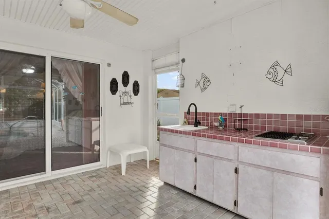 a room with a sink and wooden floor