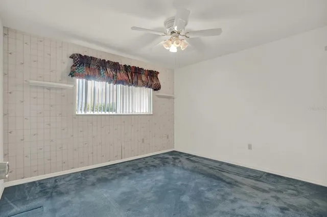 a bathroom with a sink a toilet a mirror and shower