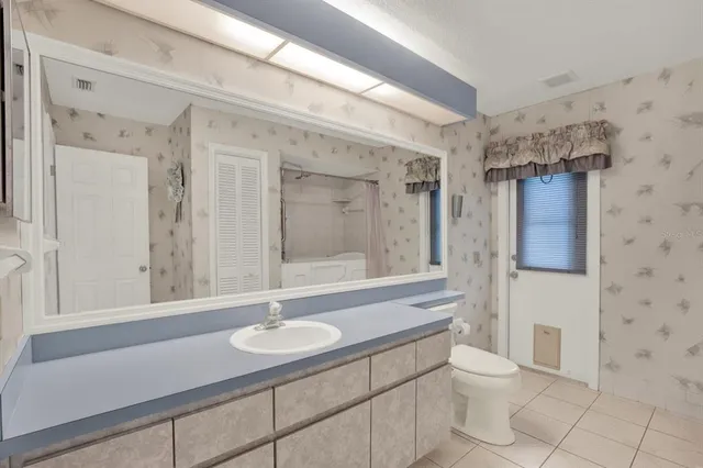 a bed room with furniture and a chandelier