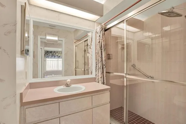 a spacious bedroom with a bed and a window