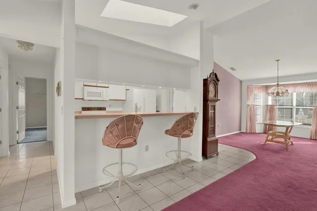 a kitchen with a stove a refrigerator and a sink