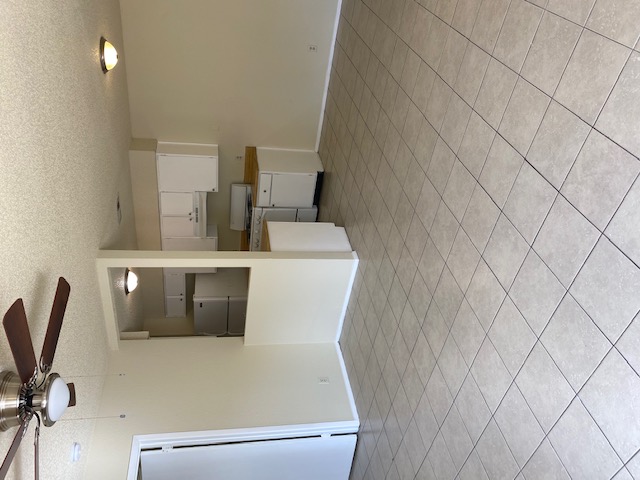 110 Verna Spur Georgetown, TX 78628 - Photo 4 of 7 Functional kitchen and living area, featuring practical tile flooring for everyday living.