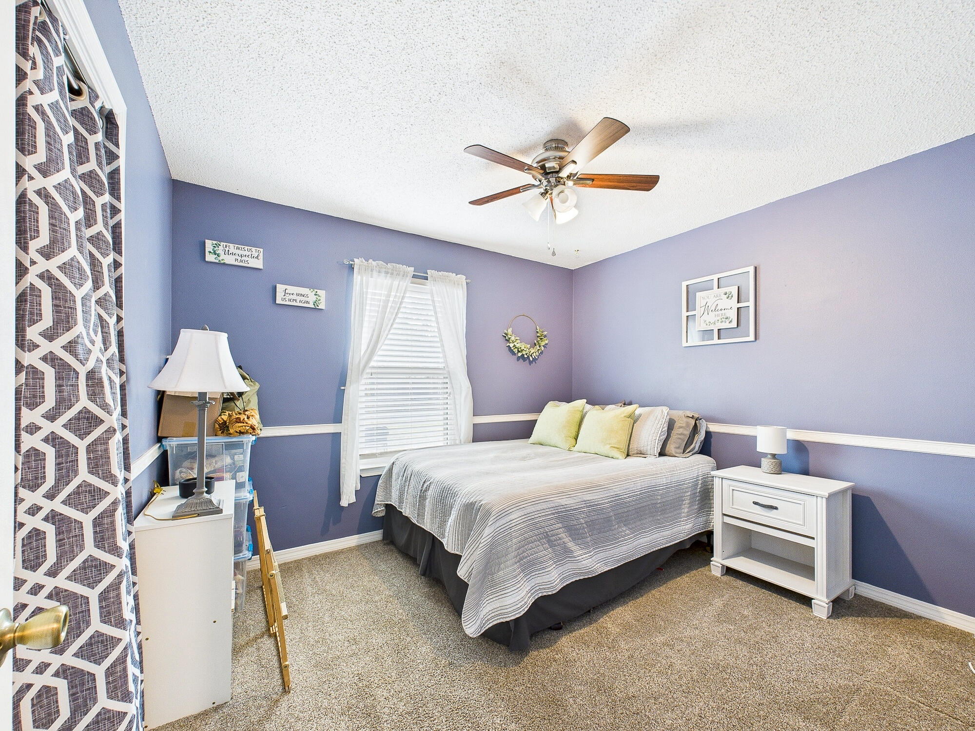 955 Valley Road Crestview, FL 32539 - Photo 18 of 29 a bedroom with a bed and a chandelier
