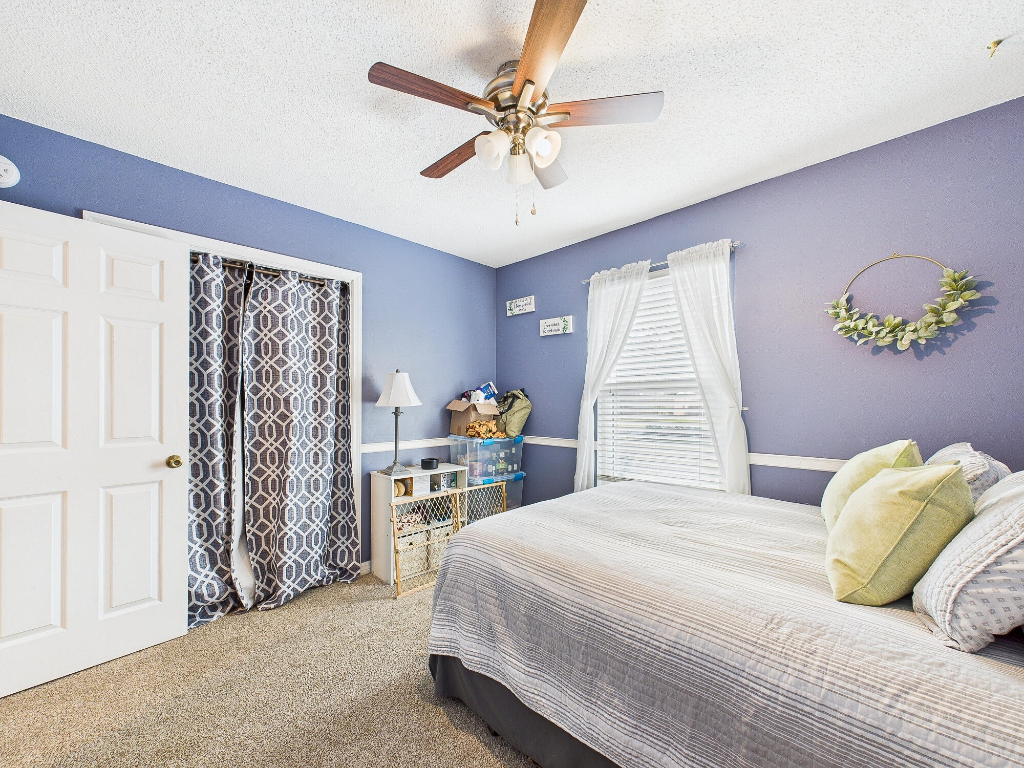 955 Valley Road Crestview, FL 32539 - Photo 19 of 29 a bedroom with a bed and a chandelier