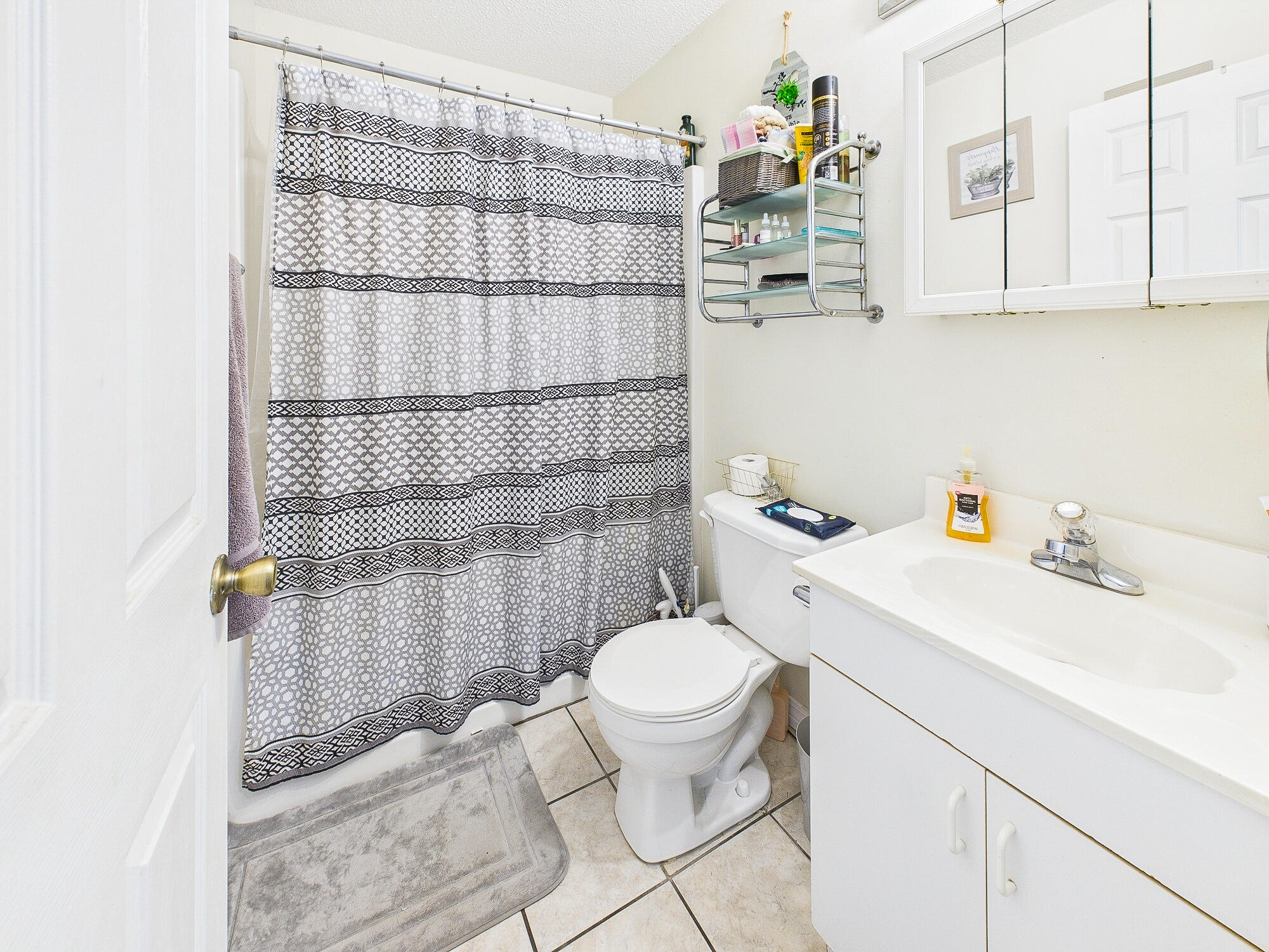 955 Valley Road Crestview, FL 32539 - Photo 20 of 29 a bathroom with a sink a toilet and shower