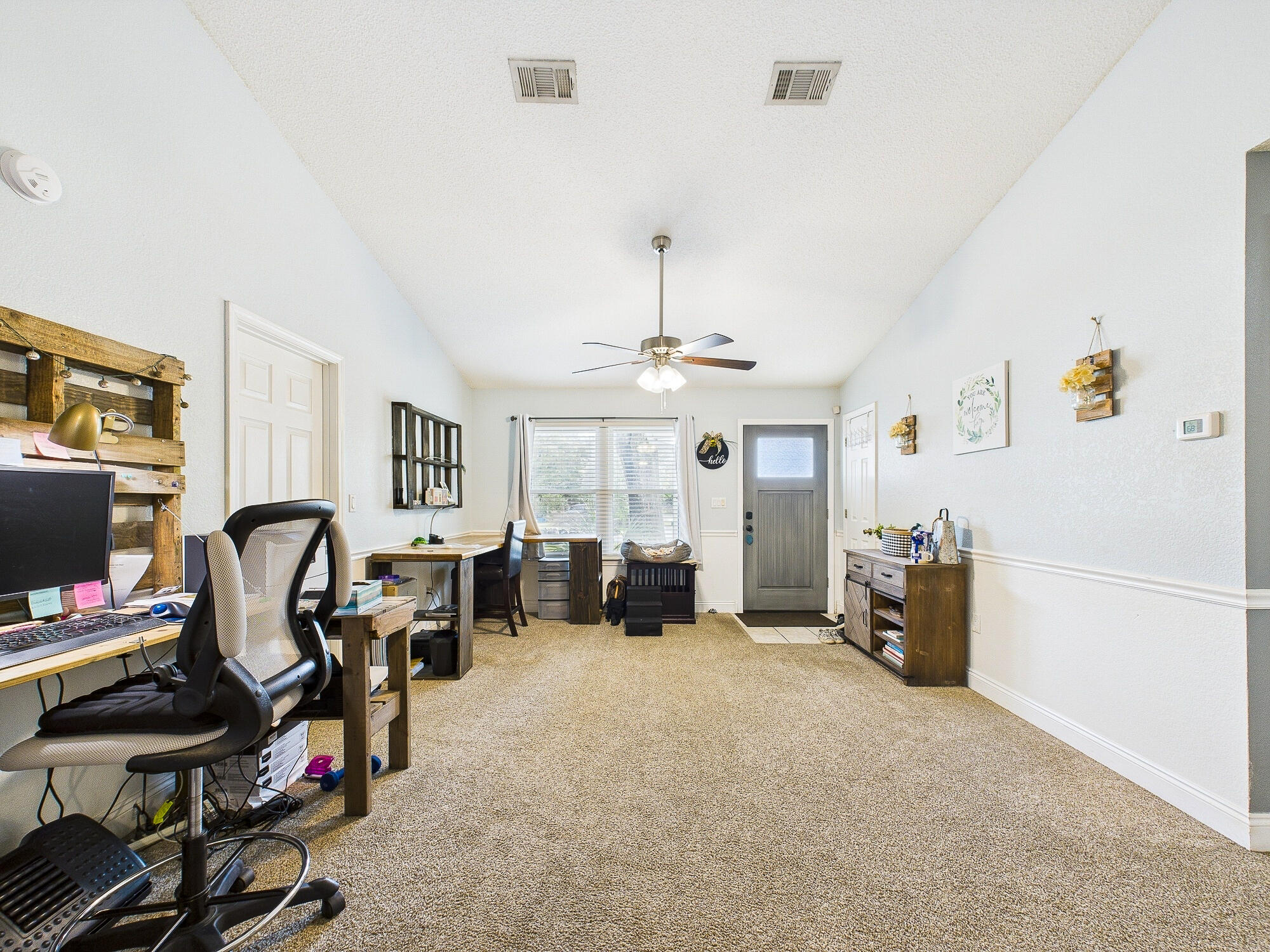 955 Valley Road Crestview, FL 32539 - Photo 6 of 29 a view of a livingroom with workspace and a window