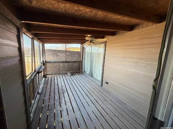 a view of outdoor space with wooden floor