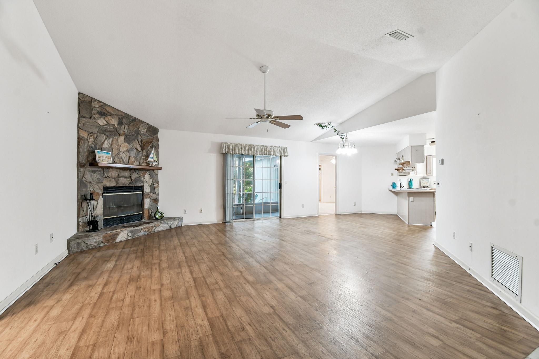 439 Gentian Road St. Augustine, FL 32086 - Photo 8 of 49 wooden floor in an empty room with a window
