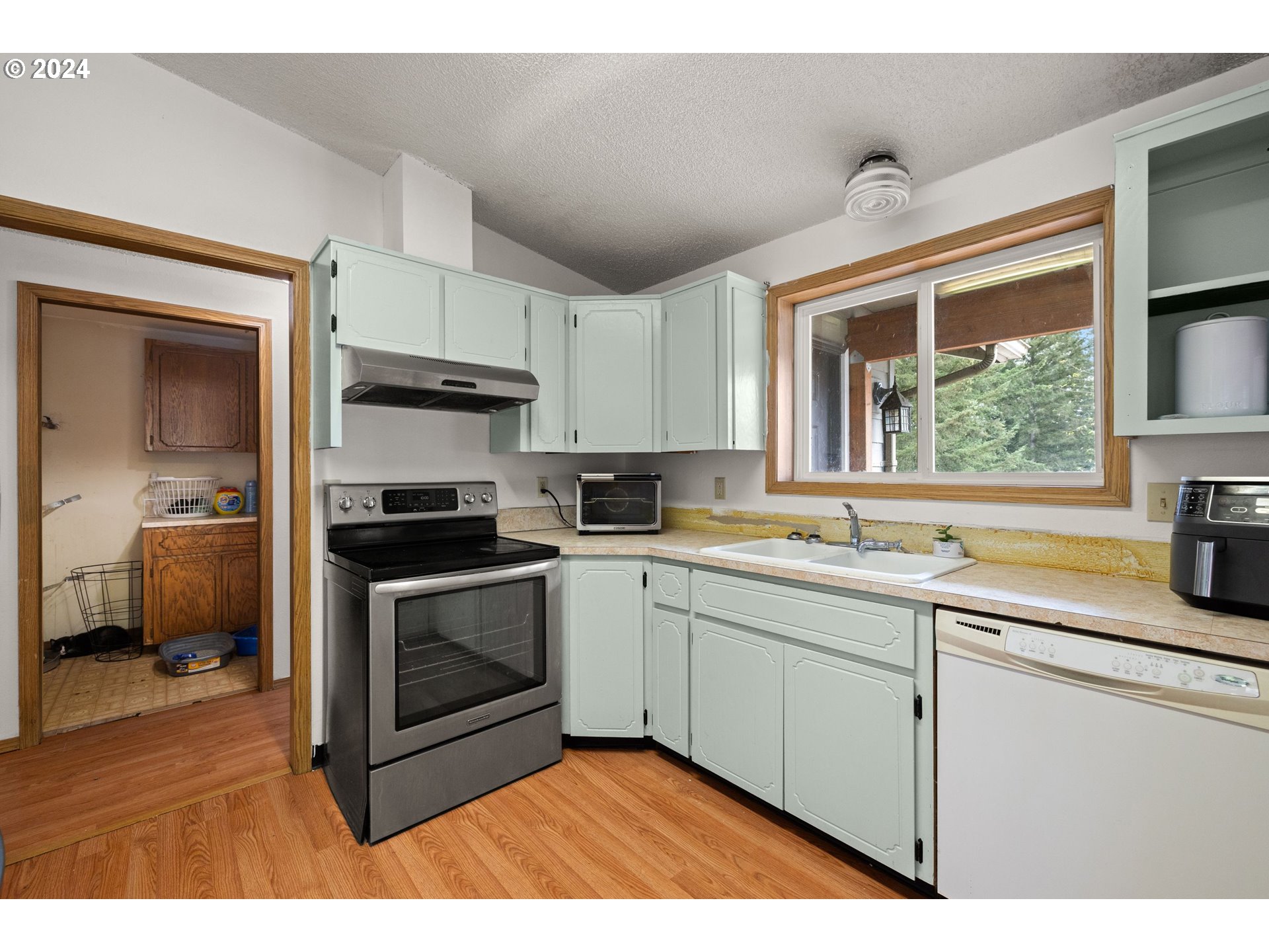 2701 Northeast 292nd Avenue Camas, WA 98607 - Photo 11 of 38 a kitchen with stainless steel appliances granite countertop a sink and a stove