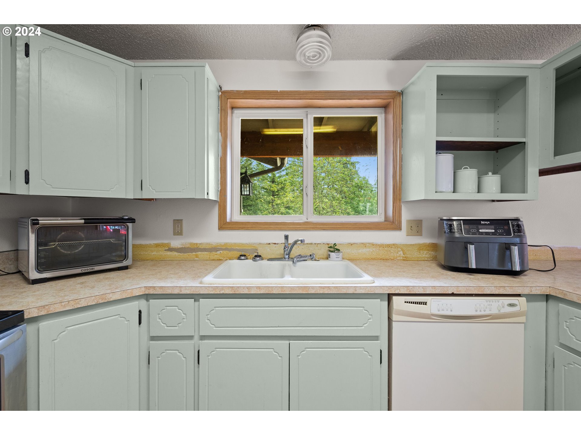2701 Northeast 292nd Avenue Camas, WA 98607 - Photo 13 of 38 a kitchen with stainless steel appliances granite countertop a sink stove and cabinets