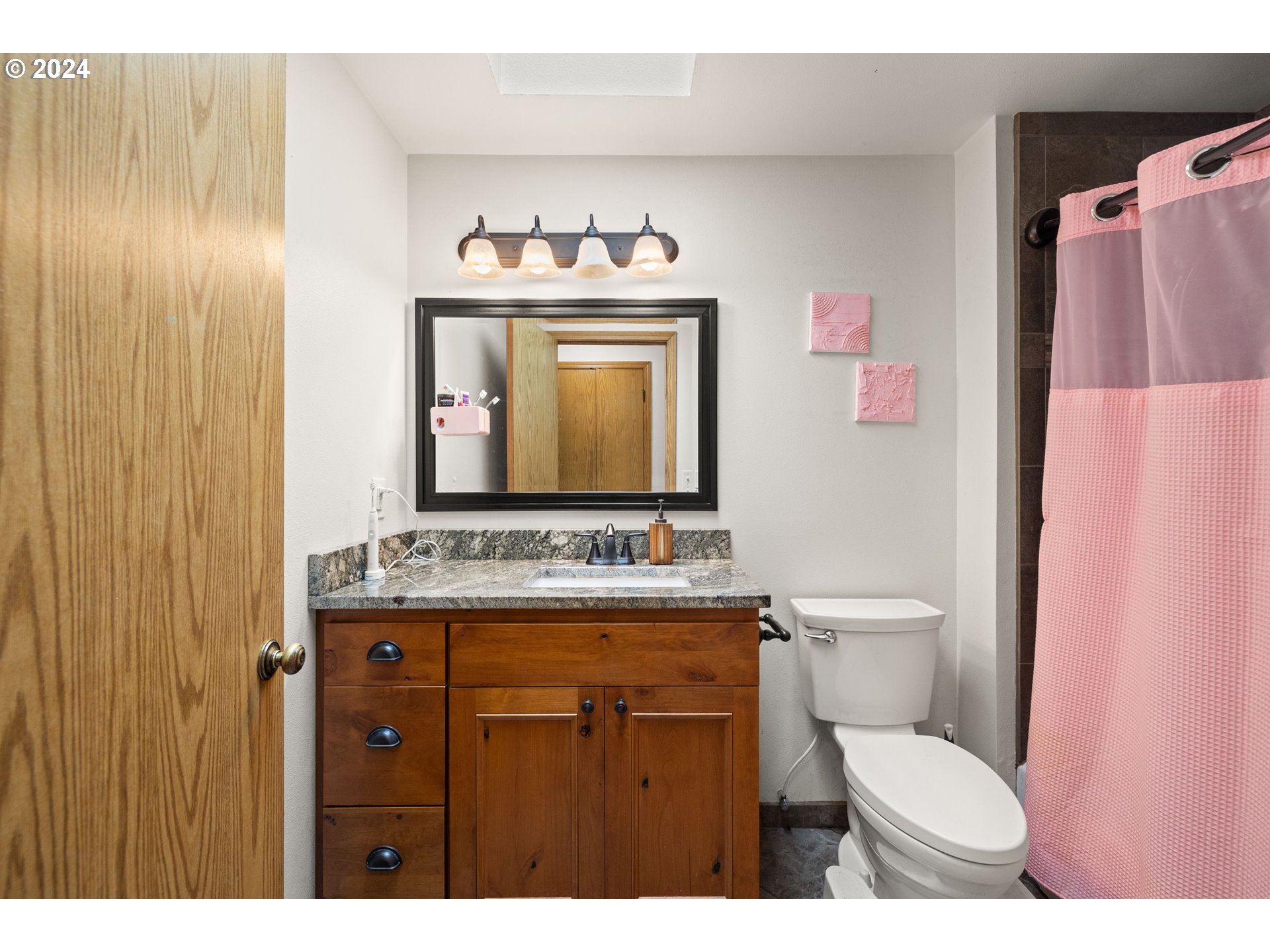 2701 Northeast 292nd Avenue Camas, WA 98607 - Photo 14 of 38 a bathroom with a toilet sink and mirror