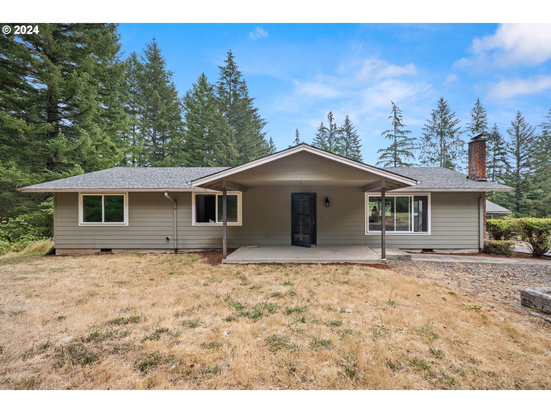 2701 Northeast 292nd Avenue Camas, WA 98607 - Photo 2 of 38 a house with trees in the background