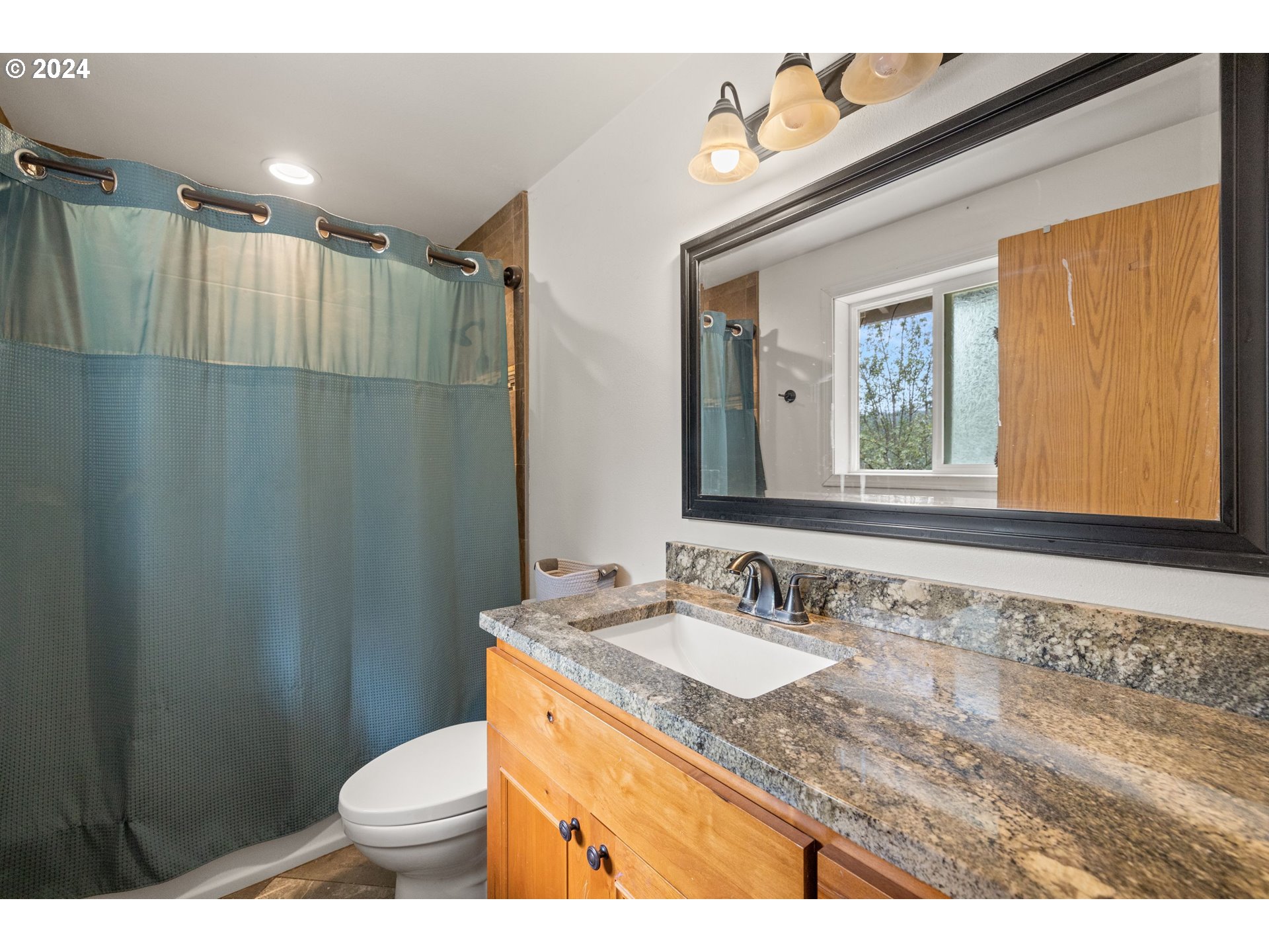 2701 Northeast 292nd Avenue Camas, WA 98607 - Photo 22 of 38 a bathroom with a granite countertop sink toilet and shower