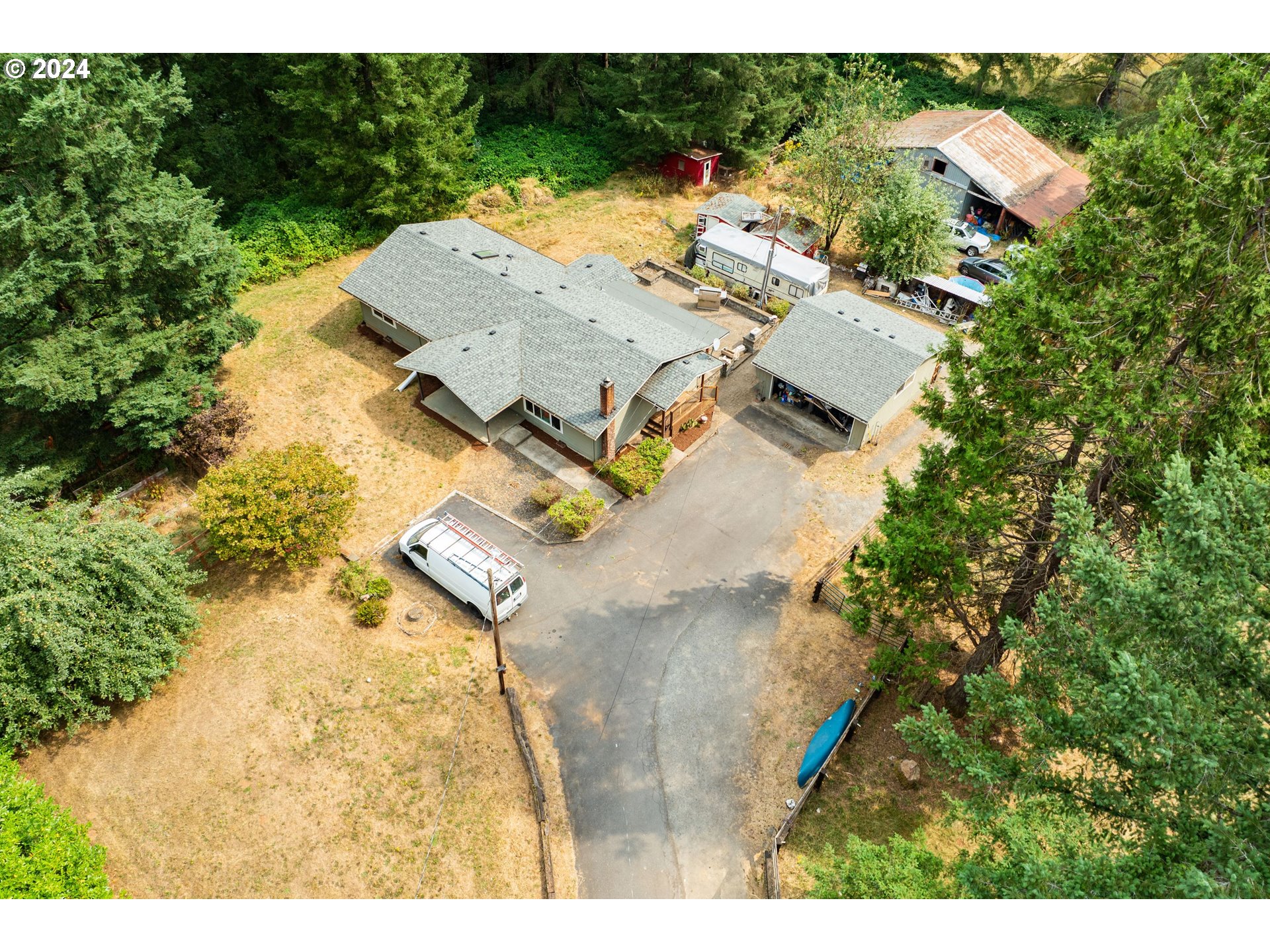 2701 Northeast 292nd Avenue Camas, WA 98607 - Photo 28 of 38 an aerial view of residential house with outdoor space and trees all around