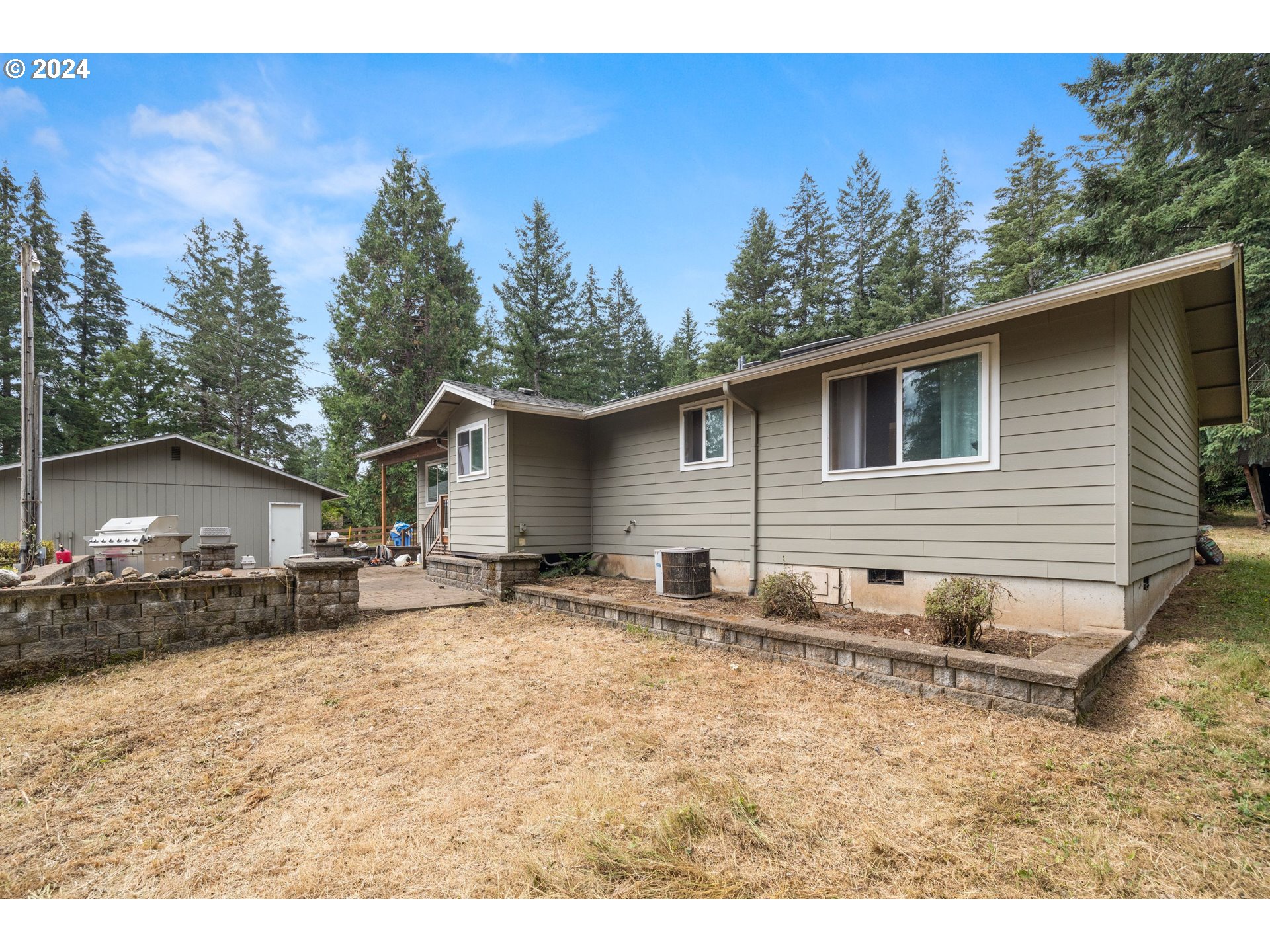 2701 Northeast 292nd Avenue Camas, WA 98607 - Photo 3 of 38 a backyard of a house with table and chairs