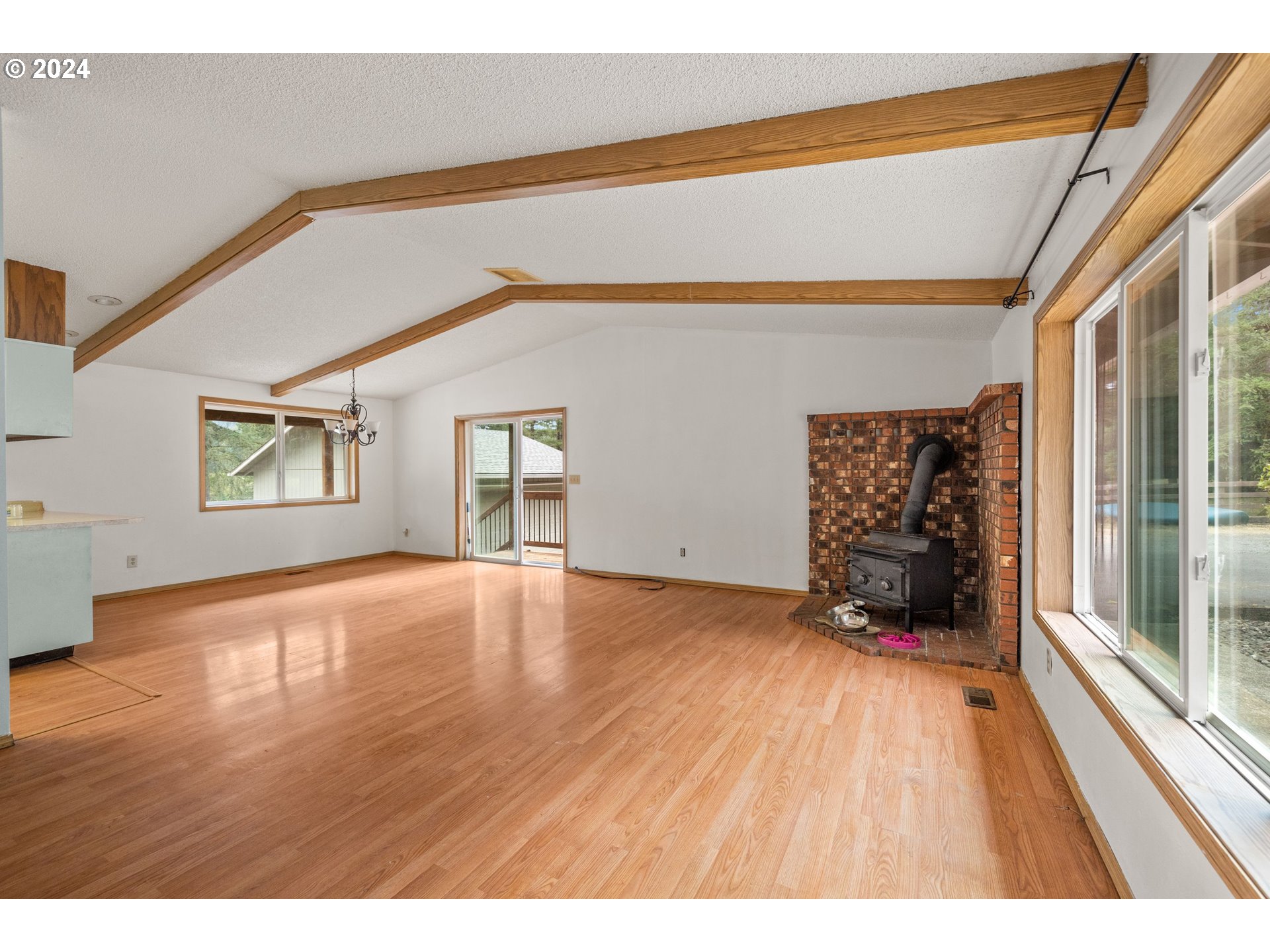 2701 Northeast 292nd Avenue Camas, WA 98607 - Photo 5 of 38 a view of an empty room with a window and wooden floor