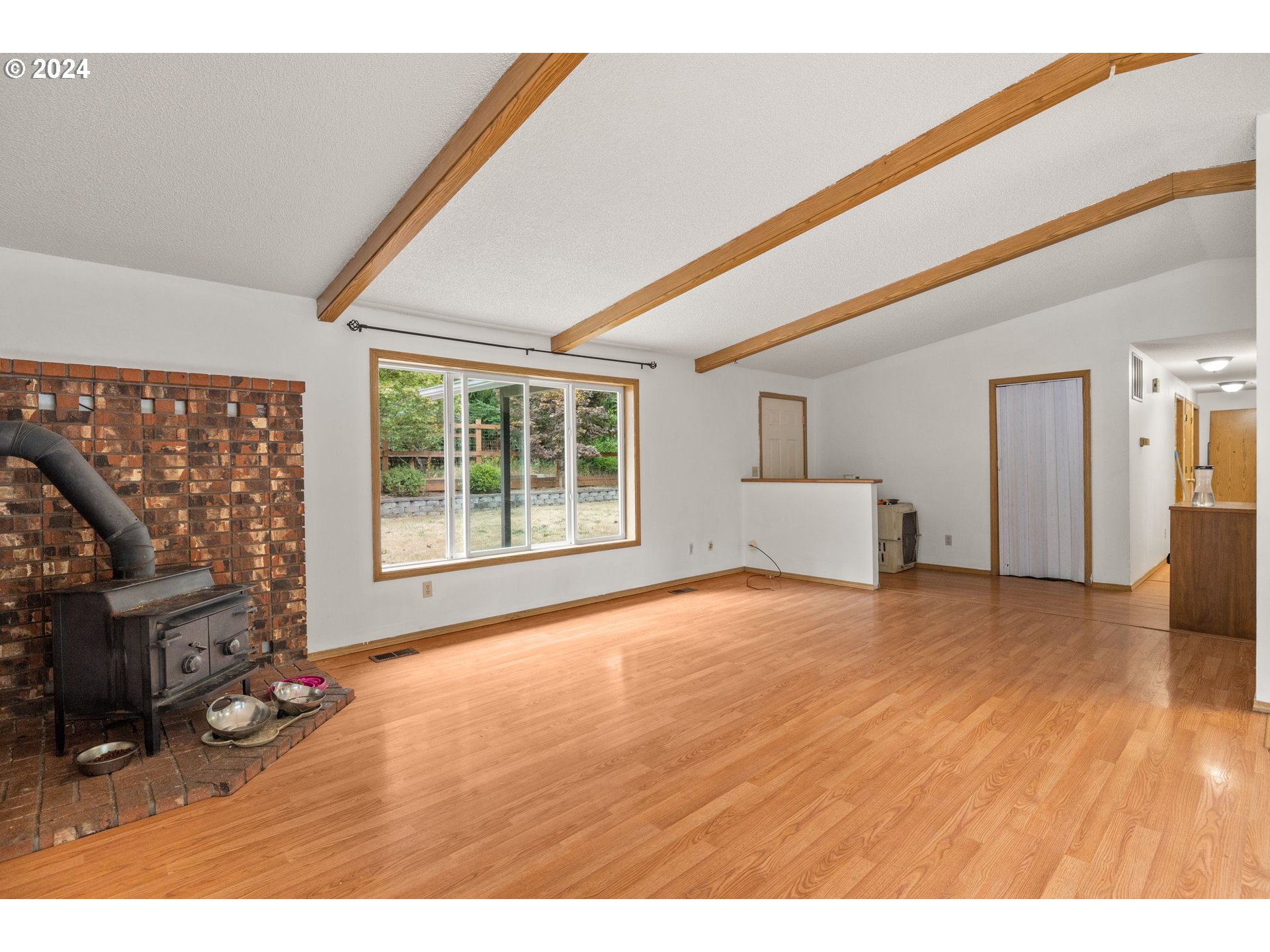 2701 Northeast 292nd Avenue Camas, WA 98607 - Photo 6 of 38 a view of an empty room with wooden floor and a window