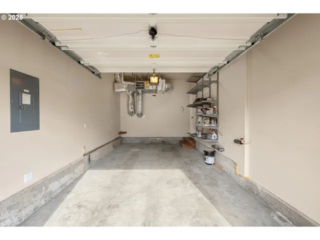 a view of a livingroom with a ceiling fan and window