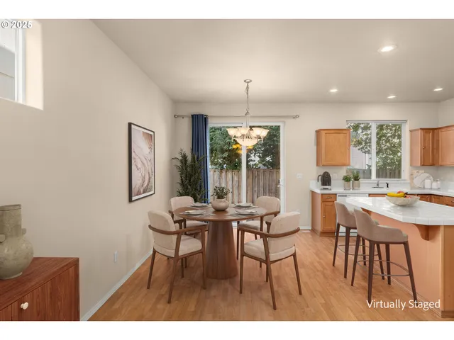 a view of a dining room with furniture and window