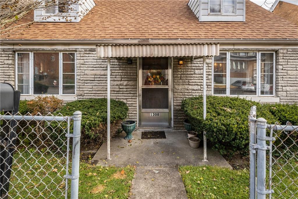 1308 Pine Hollow Road McKees Rocks, PA 15136 - Photo 2 of 25 a view of a house with backyard and sitting area