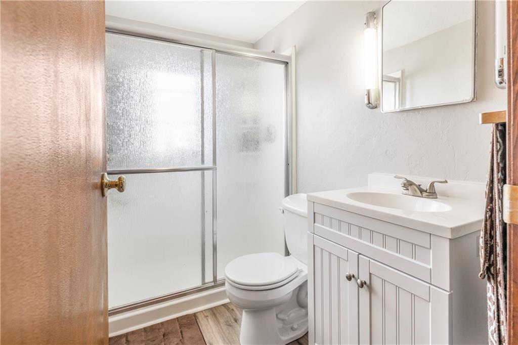 1308 Pine Hollow Road McKees Rocks, PA 15136 - Photo 11 of 25 a bathroom with a sink a toilet and shower