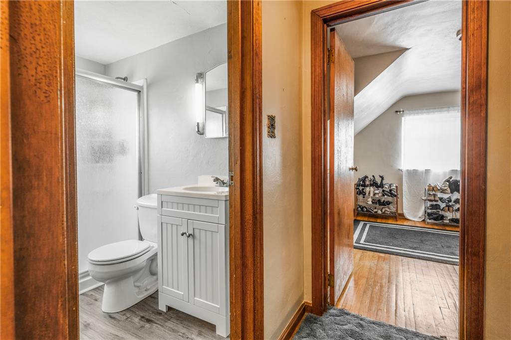 1308 Pine Hollow Road McKees Rocks, PA 15136 - Photo 12 of 25 a bathroom with a glass door shower and a toilet