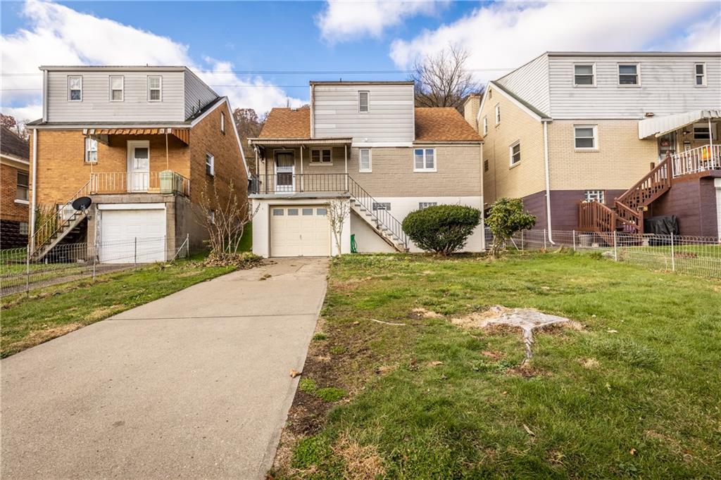 1308 Pine Hollow Road McKees Rocks, PA 15136 - Photo 3 of 25 a view of a white house with a big yard and potted plants