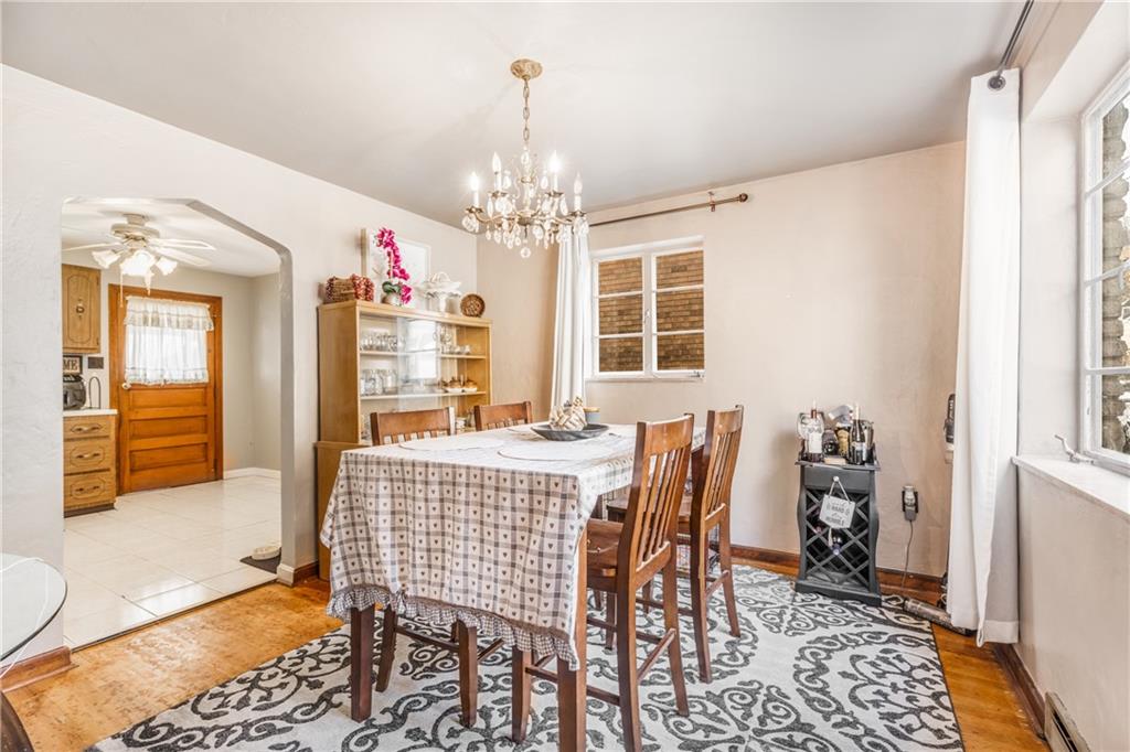 1308 Pine Hollow Road McKees Rocks, PA 15136 - Photo 23 of 25 a view of a dining room with furniture and chandelier
