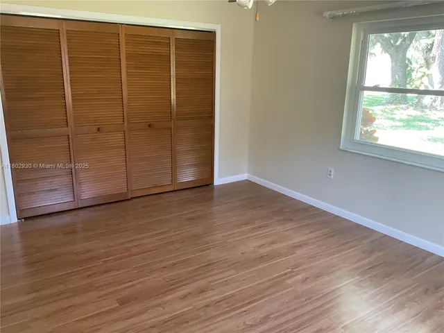 wooden floor and windows in an empty room