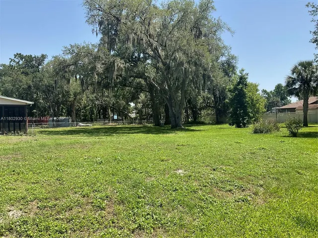 a view of a house with a big yard