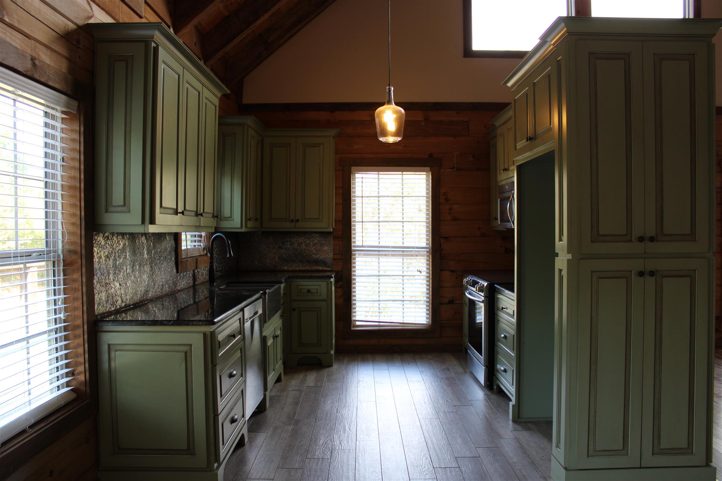 1501 Rolin Hollow Road Ardmore, TN 38449 - Photo 10 of 30 a kitchen with granite countertop a refrigerator a stove a sink and dishwasher with wooden floor