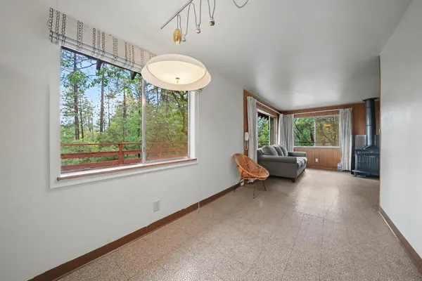 a view of a livingroom with furniture and a window