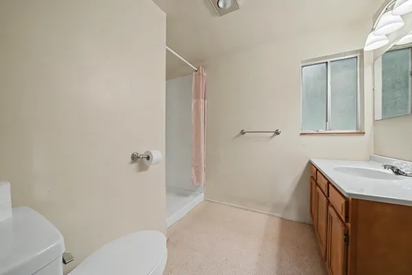 a bathroom with a sink vanity and a mirror