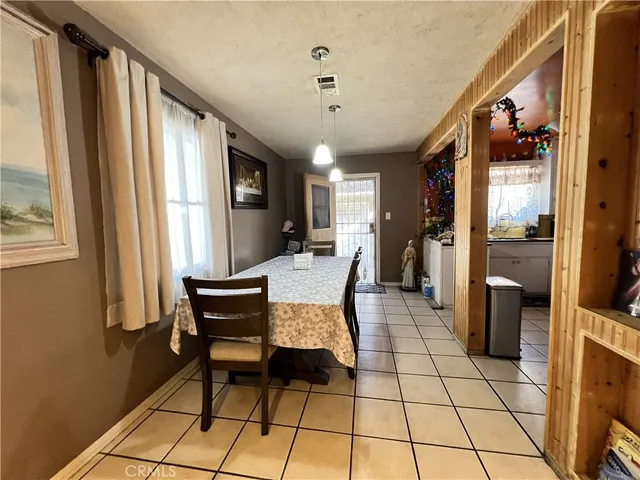 a living room with furniture and a painting