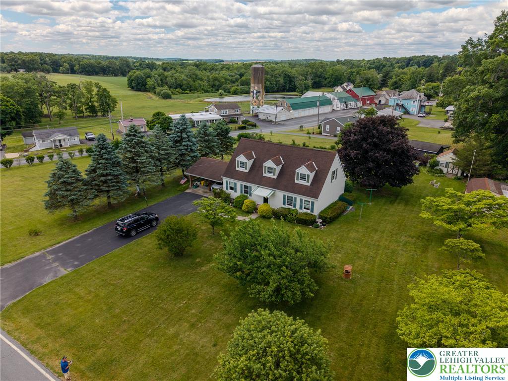 40 Locke Heights Road Bangor, PA 18013 - Photo 6 of 28 An aerial perspective reveals a charming residence nestled amidst expansive green lawns and mature trees.