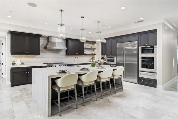 a balcony with furniture and a floor to ceiling window