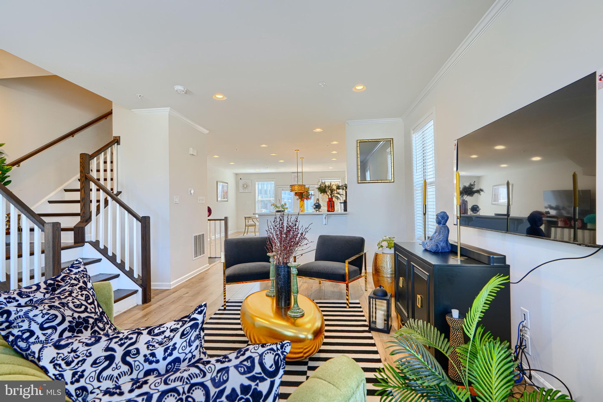 1324 Ricketts Road Frederick, MD 21702 - Photo 14 of 49 a living room with furniture and a dining table with wooden floor