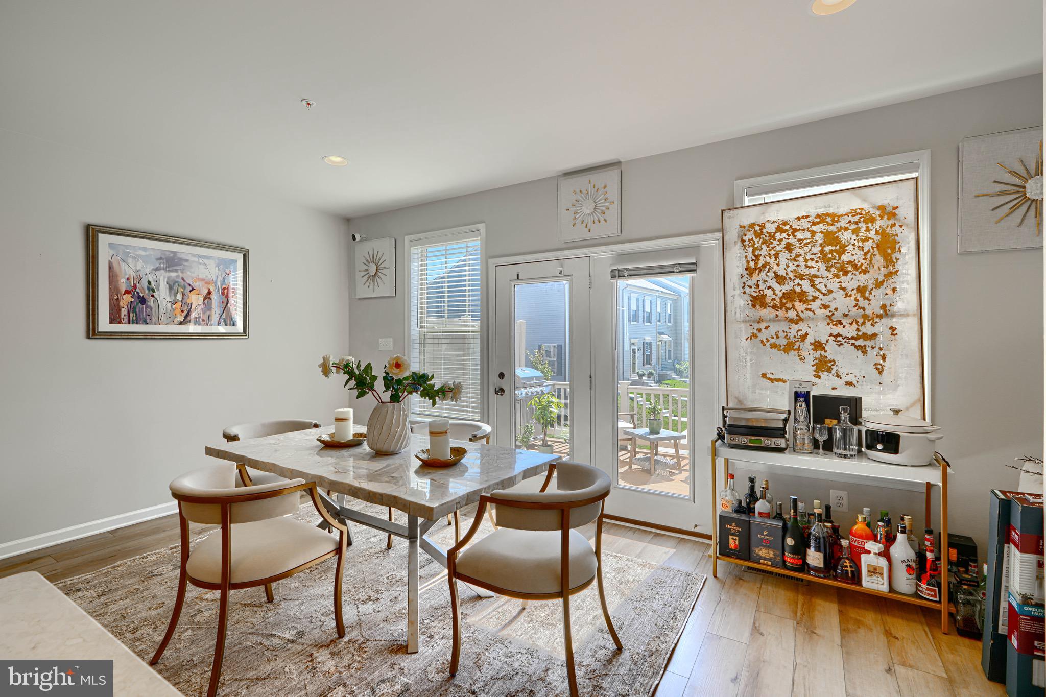 1324 Ricketts Road Frederick, MD 21702 - Photo 22 of 49 a dining room with furniture and wooden floor