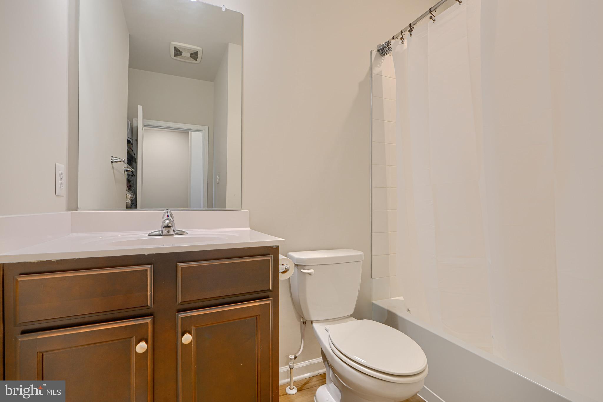1324 Ricketts Road Frederick, MD 21702 - Photo 38 of 49 a bathroom with a granite countertop toilet sink and mirror
