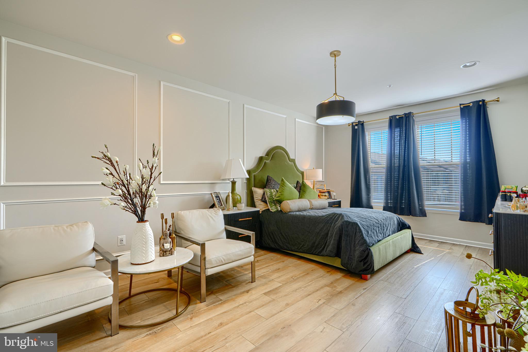 1324 Ricketts Road Frederick, MD 21702 - Photo 42 of 49 a bedroom with a bed and a chandelier