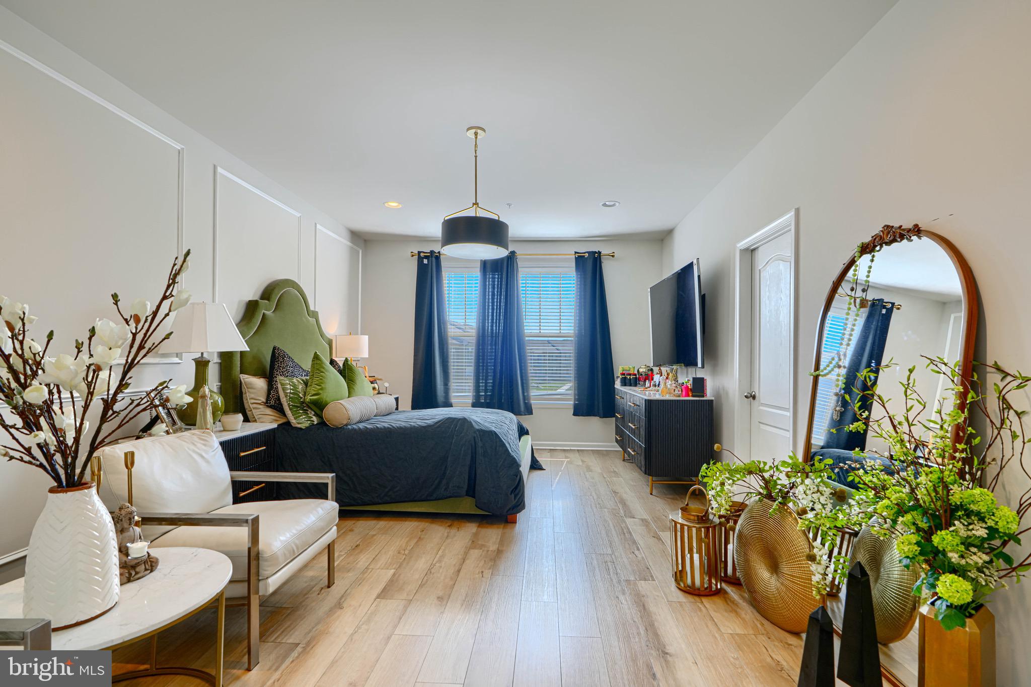 1324 Ricketts Road Frederick, MD 21702 - Photo 44 of 49 a living room with furniture flowers and a chandelier