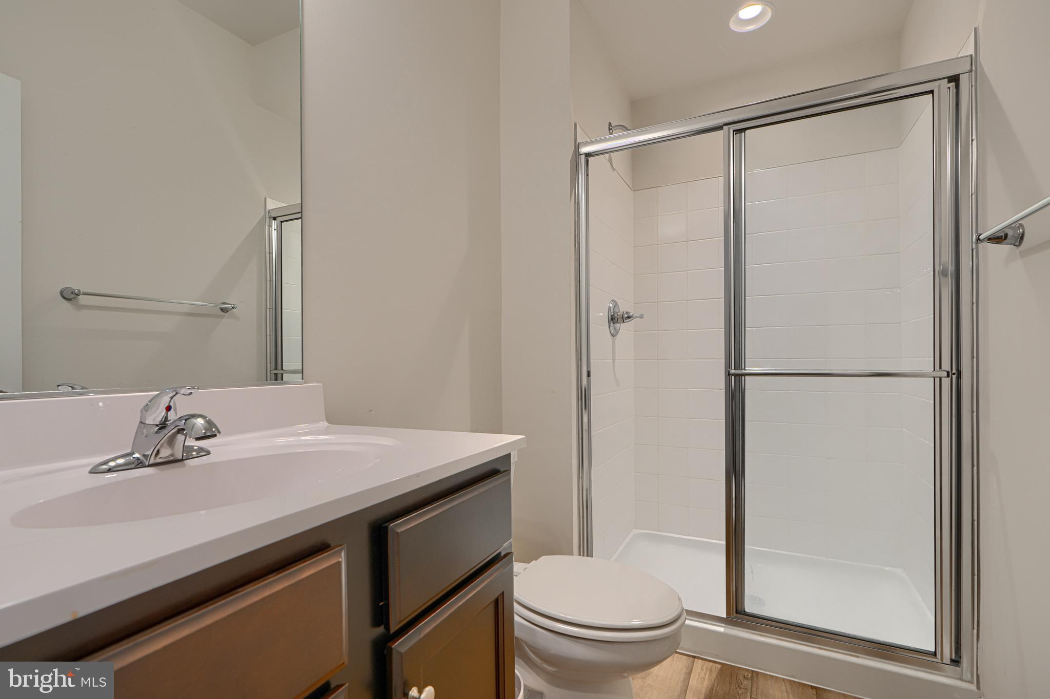 1324 Ricketts Road Frederick, MD 21702 - Photo 8 of 49 a bathroom with a sink toilet and shower