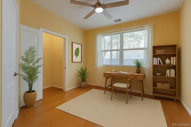 a view of a big building with a big yard and large trees