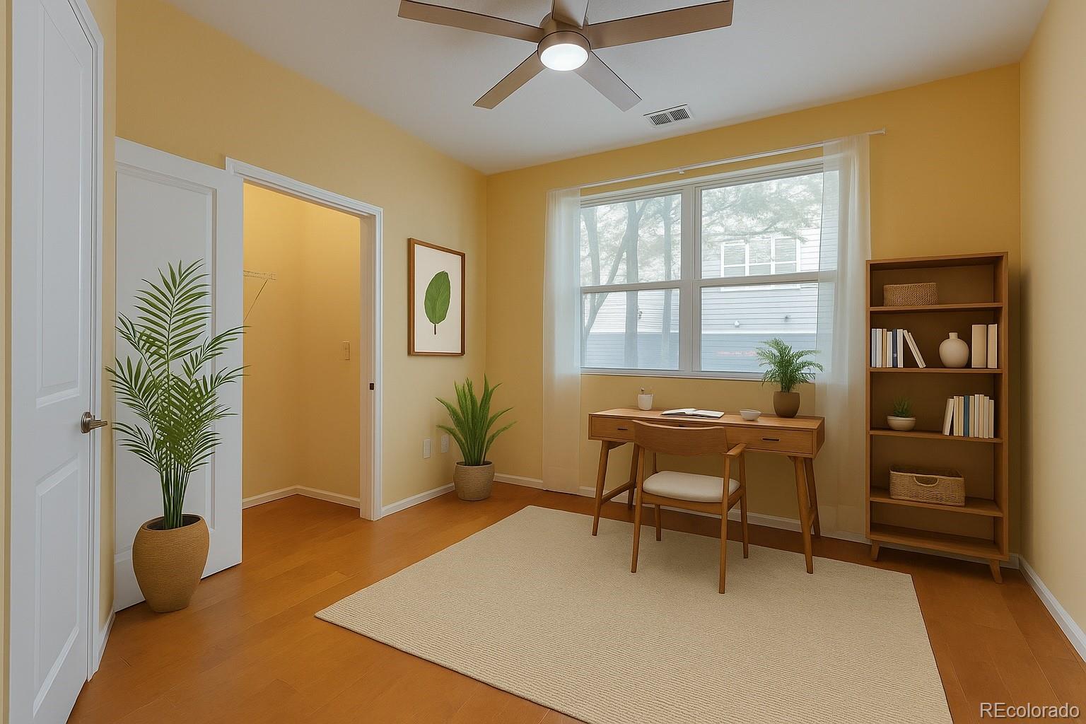 11316 Colony Circle Broomfield, CO 80021 - Photo 11 of 20 a living room with furniture and a potted plant