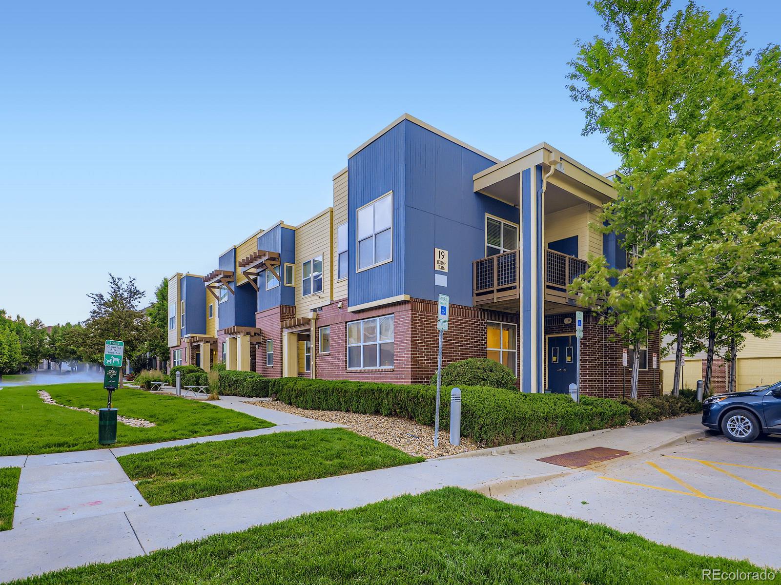 11316 Colony Circle Broomfield, CO 80021 - Photo 16 of 20 a view of a big building with a big yard and large trees