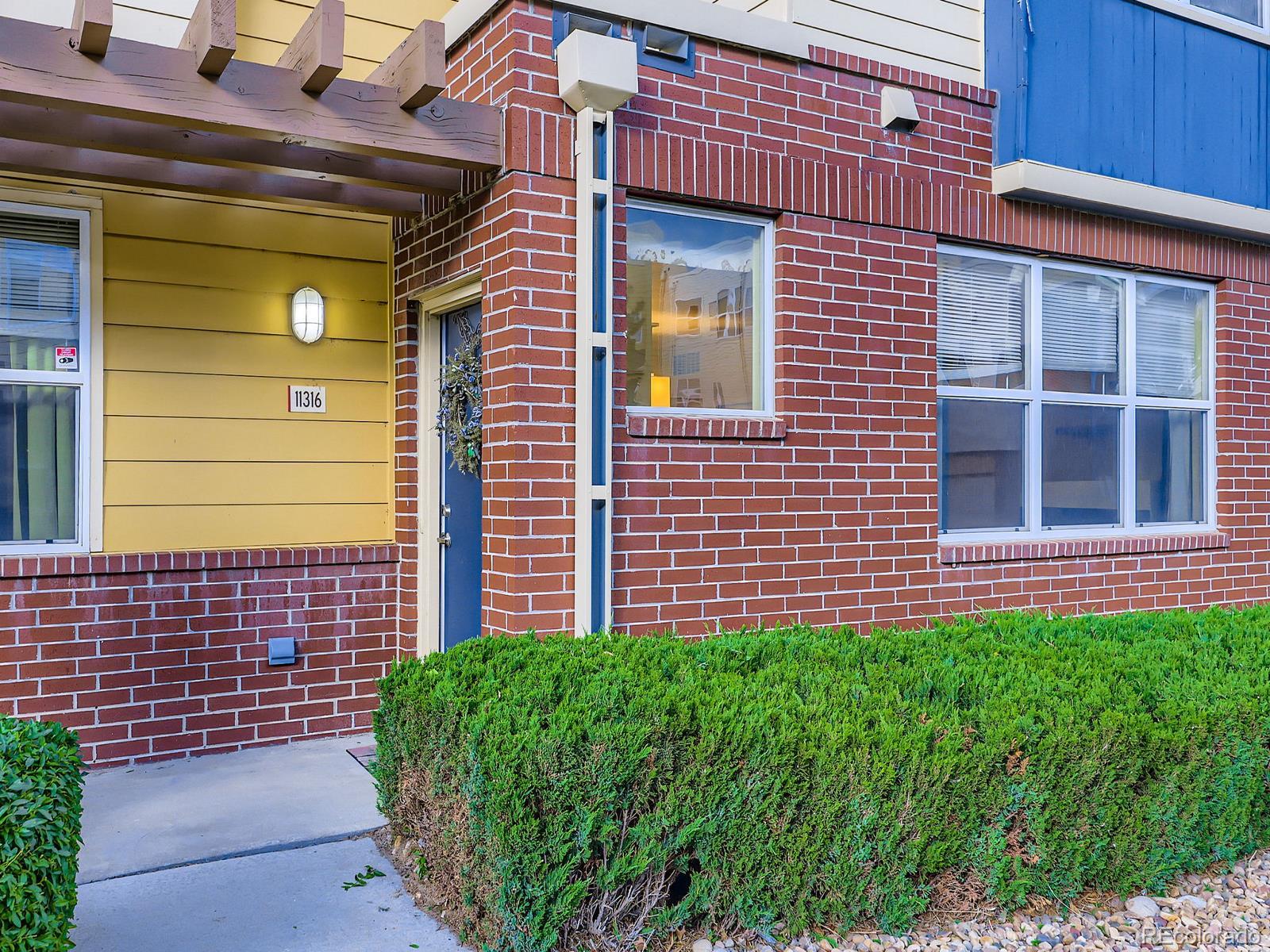 11316 Colony Circle Broomfield, CO 80021 - Photo 17 of 20 a view of a brick house with a large window