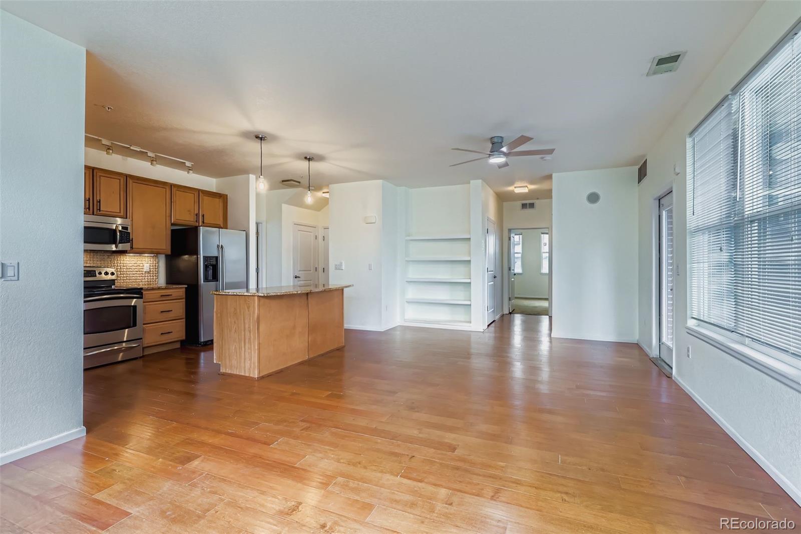 11316 Colony Circle Broomfield, CO 80021 - Photo 2 of 20 a view of kitchen with cabinets and wooden floor