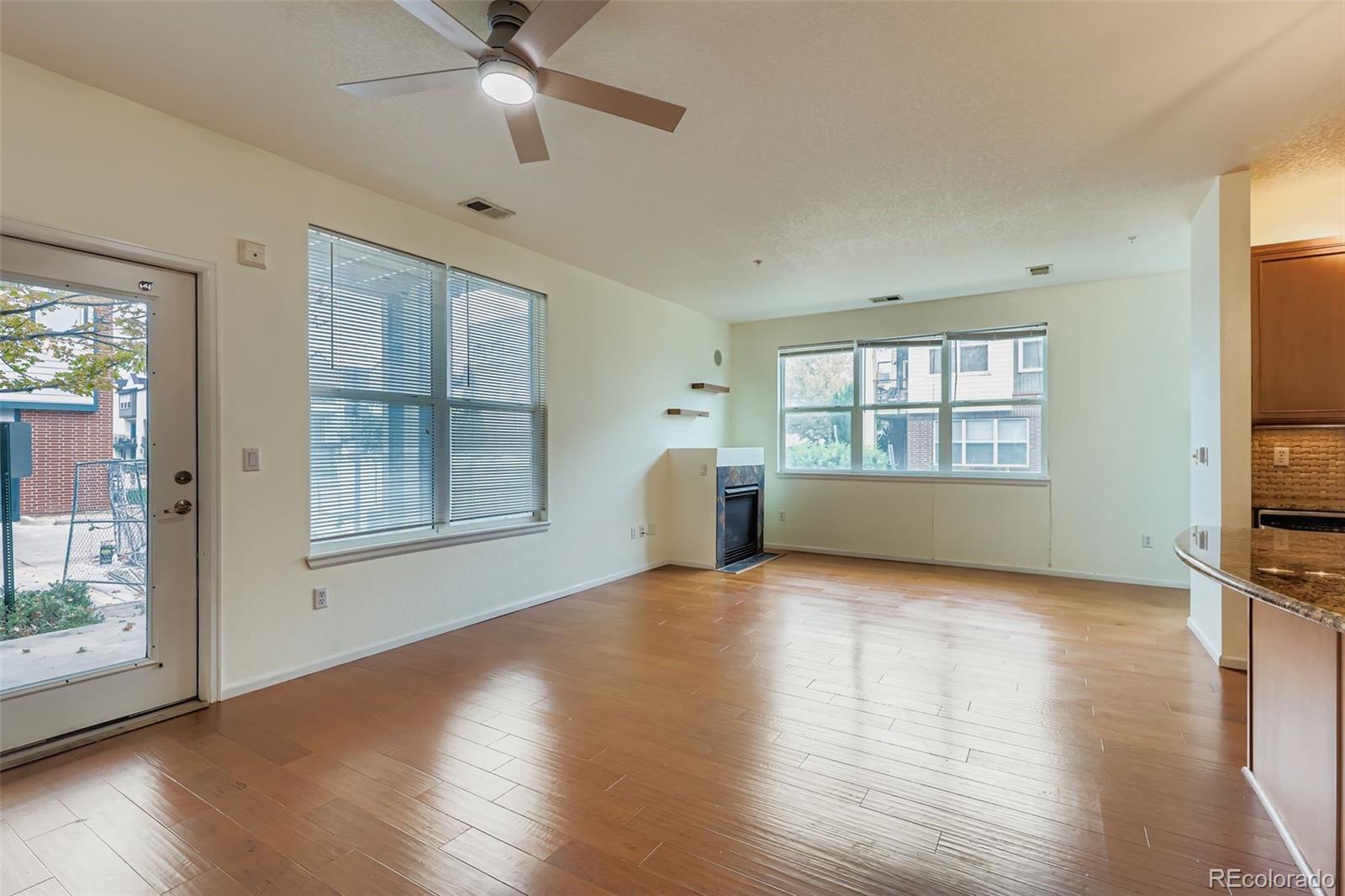 11316 Colony Circle Broomfield, CO 80021 - Photo 5 of 20 a view of a livingroom with wooden floor and a window