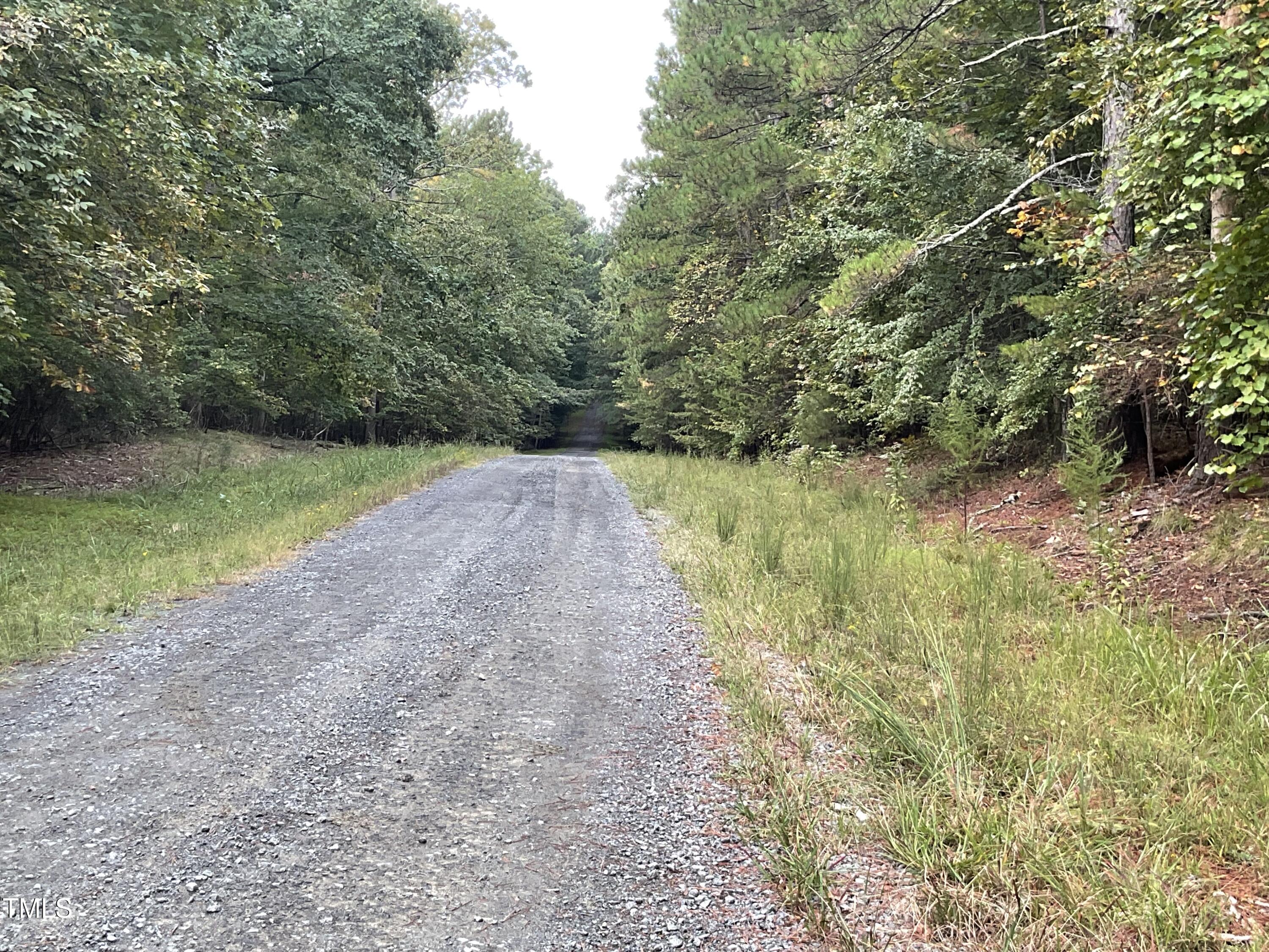 2537 Baptist Road Durham, NC 27703 - Photo 24 of 25 a view of a lake with a yard