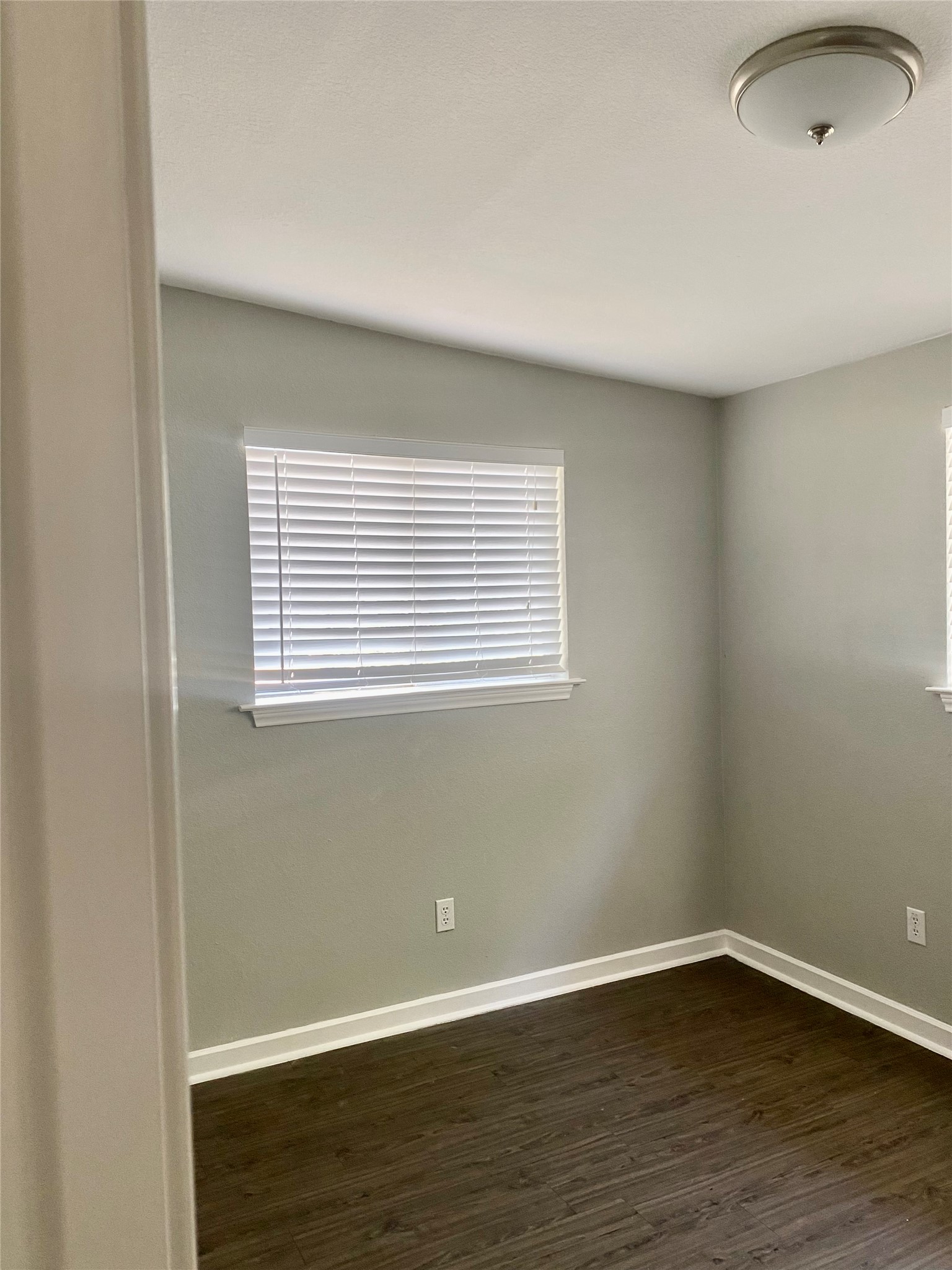 400 Swanee Drive, Unit A Austin, TX 78752 - Photo 4 of 8 a view of an empty room with wooden floor and a window
